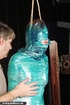 Kinky hottie gets tied up and wrapped in plastic