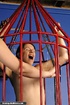 Caged slut gets a painful tits treatment by her mistress