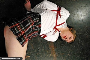 Naughty tied up schoolgirl enjoys rough  - Picture 1