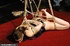 Bondage chick tied in ropes and fucked with a dildo