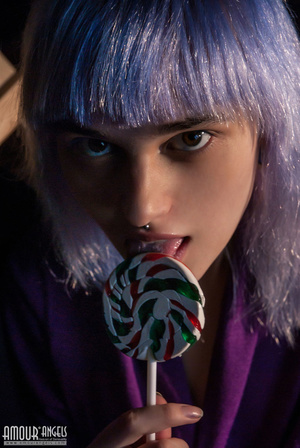 Naughty purple haired teen gal licks a nice lollipop - Picture 1