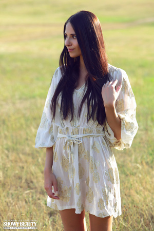 Pretty young babe lifts up her skirt and reveals her lusty pussy before she takes off her white robe and seduces with her small tits and skinny body as she pose naked on a grassy field. - XXXonXXX - Pic 2