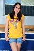 Foxy chick wearing orange shirt shows her petite tits before she takes