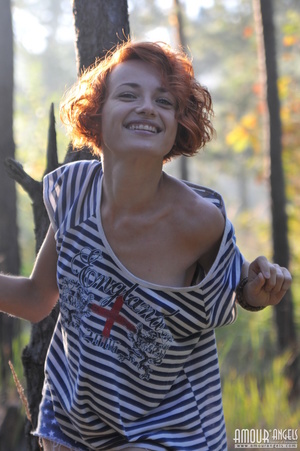 Marvelous redhead chick posing in the woods - XXXonXXX - Pic 1