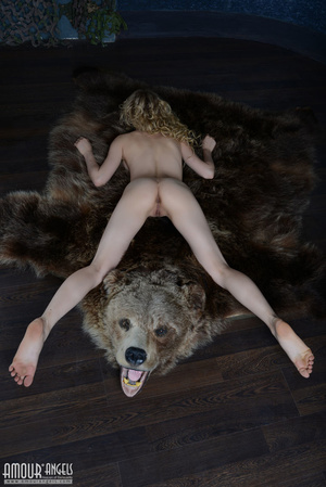 Curly haired blonde gal posing with a stuffed bear - Picture 20