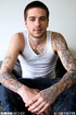 Tattooed stud peels off his white shirt then shows his hard body before