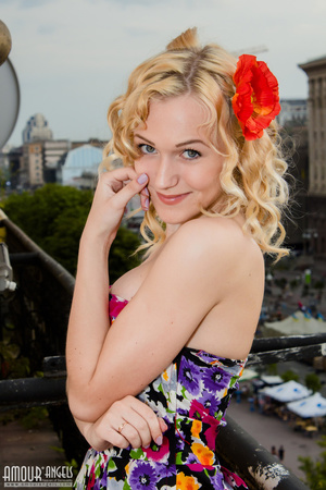 Curly haired blonde takes off her sexy colorful dress - XXXonXXX - Pic 2