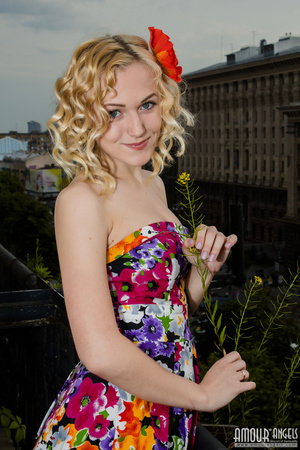 Curly haired blonde takes off her sexy colorful dress - XXXonXXX - Pic 3