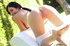 Teen babe displays her banging body outside while eating fruits on a white