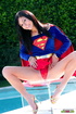 Luscious teen in hot red, blue and yellow Supergirl costume slowly gets