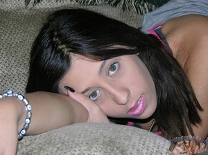Sweet hottie displays her skinny body in pink shirt and red shorts then slowly strips them off and expose her petite boobs and indulging pussy in different poses on a gray couch, blue bed and wooden chest. - XXXonXXX - Pic 4