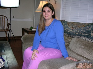Chubby babe sits on a gray couch then peels off her blue shirt and tight pink pants before she displays her huge body in hot underwear then takes them off and expose her large boobs and ravishing pussy in different positions on a gray couch and bed. - XXXonXXX - Pic 1