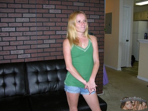 Cute teen blonde strips off her green shirt and shows her small tits as she pose topless on a black couch before she peels down her jeans shorts and expose her lusty pussy in different poses on a vari-colored polka dotted bed before she grabs a bald dude's dick and jacks it hard. - XXXonXXX - Pic 1