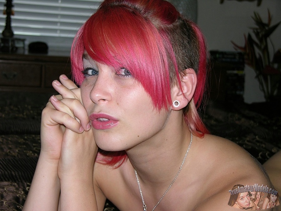 Beautiful babe with pink hair strips off her violet and white checkered skirt and seduces with her banging body in black underwear before she takes off her top and expose her petite tits then peels down her thong and shows her alluring pussy on a gray couch and brown bed. - XXXonXXX - Pic 14