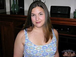 Chubby chick peels off her multi-colored shirt and gray bra then bares her huge boobs before she strips down her green shorts and pink and white panty then reveals her juicy pussy in different positions on a gray couch and a brown bed. - XXXonXXX - Pic 1