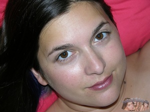 Chubby chick peels off her multi-colored shirt and gray bra then bares her huge boobs before she strips down her green shorts and pink and white panty then reveals her juicy pussy in different positions on a gray couch and a brown bed. - Picture 16