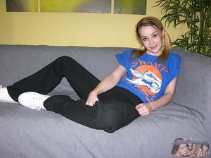 Sweet chick displays her foxy body on a gray couch wearing blue shirt, black pants and white socks before she takes them off and reveals her skinny body with petite tits and indulging pussy in different positions on a black couch and black and white bed then grabs her boyfriend's dick and jacks it hard. - Picture 1