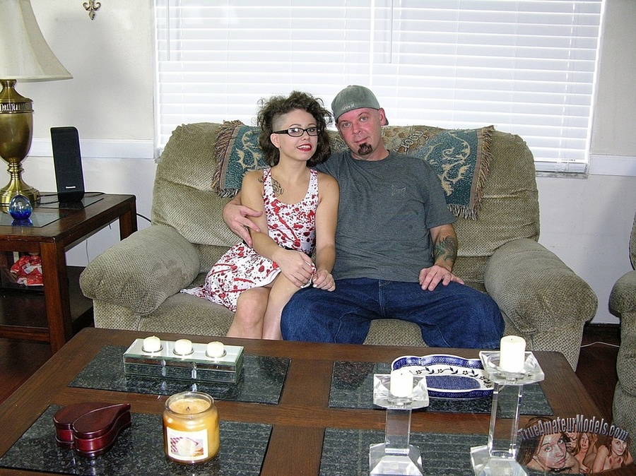 Curly babe in red and white dress wearing glasses gets on her knees and sucks a huge cock til it cums in her mouth on a brown couch. - XXXonXXX - Pic 1