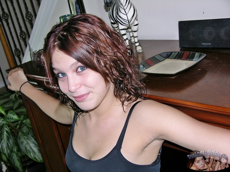 Beautiful brunette allures with her steaming hot body before she peels off her shirt and bra and expose her tiny boobs then strips down her jeans shorts and black thong and reveals her indulging pussy on a gray couch. - XXXonXXX - Pic 3