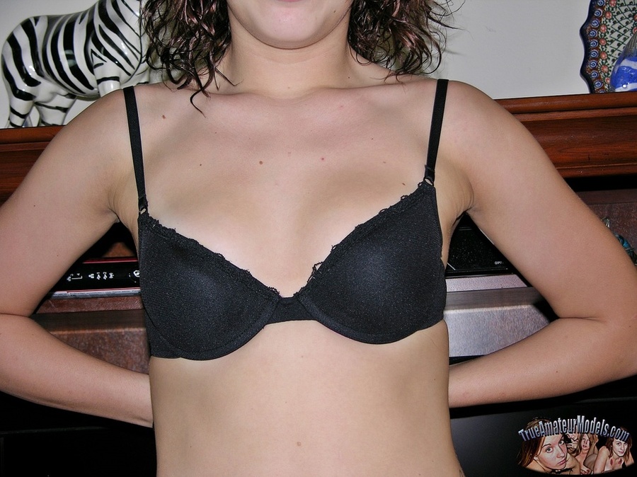 Beautiful brunette allures with her steaming hot body before she peels off her shirt and bra and expose her tiny boobs then strips down her jeans shorts and black thong and reveals her indulging pussy on a gray couch. - XXXonXXX - Pic 4