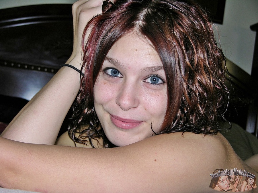 Beautiful brunette allures with her steaming hot body before she peels off her shirt and bra and expose her tiny boobs then strips down her jeans shorts and black thong and reveals her indulging pussy on a gray couch. - XXXonXXX - Pic 15