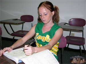 Teen cheerleader in pigtails peels down her pink and blue panty and expose her sweet pussy in different poses on a green seat wearing her green and yellow uniform before she takes it off and lays naked on a violet and white bed. - Picture 4