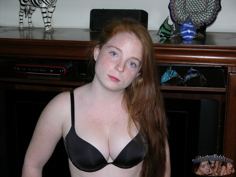Cute redhead peels off her gray see through blouse and black bra and shows her big juggs then strips down her jeans and black panty and reveals her hot crack as she pose naked on a gray couch, brown bed and white tub. - XXXonXXX - Pic 2