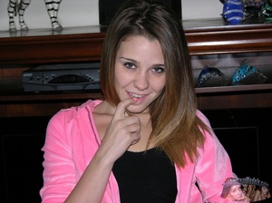 Young hottie with steaming hot body takes off her pink jacket and black skirt then displays her luscious butt before she removes her black shirt and pink panty with multi-colored floral designs and teases with her alluring crack in different poses wearing her pink and green striped socks on a gray couch, white tub and black bed. - XXXonXXX - Pic 2