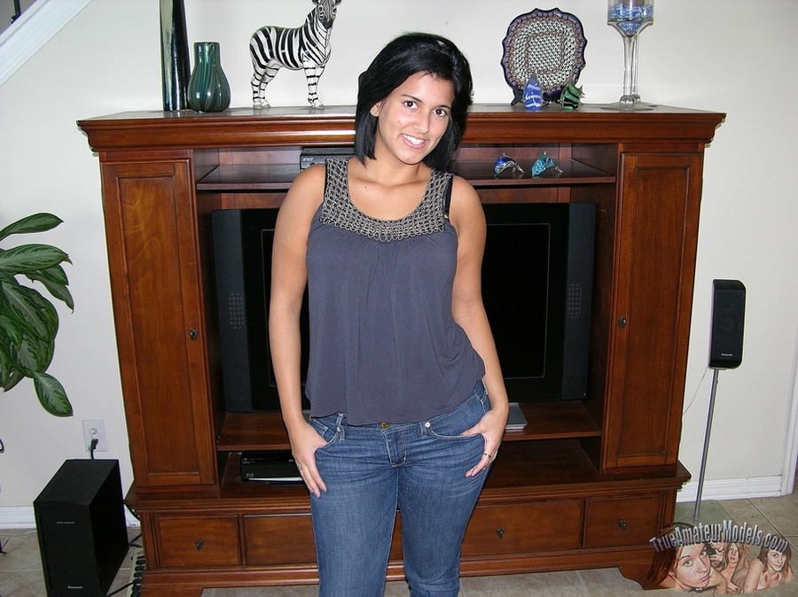 Gorgeous babe pose her banging body then peels off her gray blouse and pink bra and reveals her juicy round boobs before she strips down her jeans and multi-colored panty and expose her lusty pussy as she pose naked on a gray couch and brown bed. - XXXonXXX - Pic 1