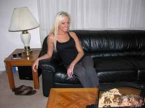 Smoking hot blonde pose her foxy body on a black couch wearing her sexy black shirt, jeans and pink panty then strips them off piece by piece and shows her alluring crack and petite boobs on a black chair. - XXXonXXX - Pic 1