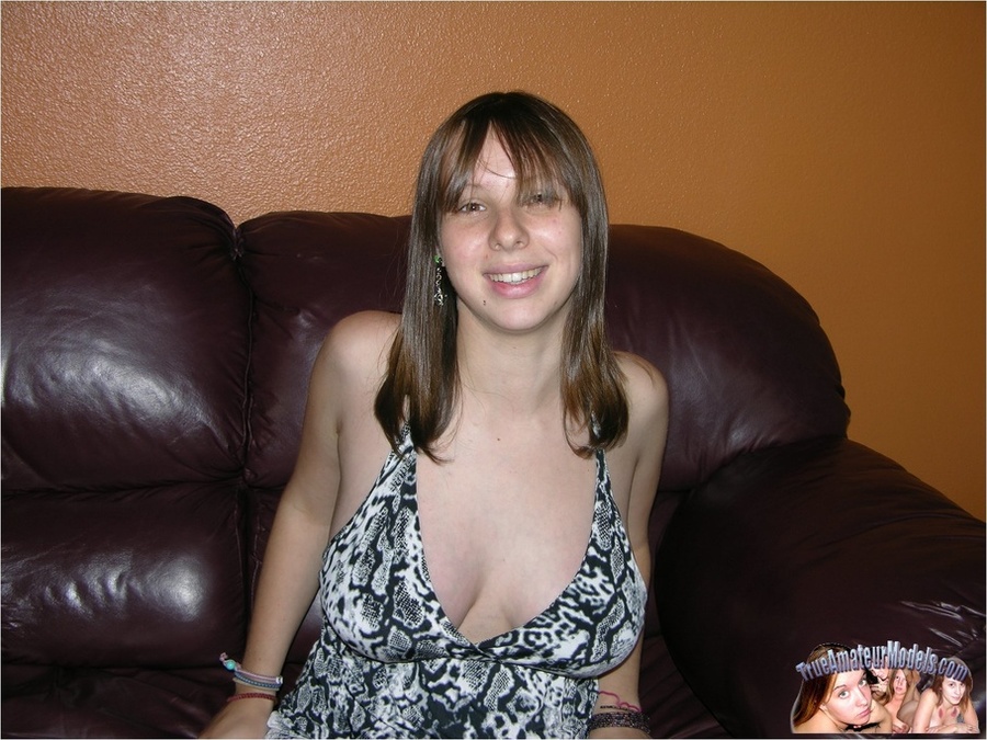 Pregnant young babe wearing black and white dress opens her legs wide on a brown couch and reveals her clean shaved pussy before she gets naked and shows big round tits and big belly on a white and gray bed. - XXXonXXX - Pic 1