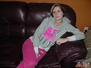 Sweet babe sits on a brown couch while she slowly strips off her white and gray striped sweater, pink pants and gray shoes then expose her skinny body with petite tits and indulging pussy on a purple bed. - XXXonXXX - Pic 1
