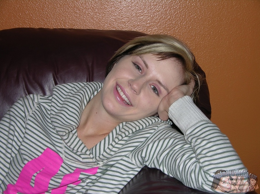Sweet babe sits on a brown couch while she slowly strips off her white and gray striped sweater, pink pants and gray shoes then expose her skinny body with petite tits and indulging pussy on a purple bed. - XXXonXXX - Pic 2