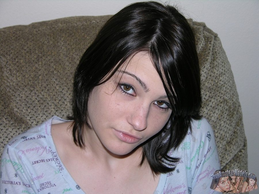 Pretty chick shows her juicy ass and lusty pussy on a gray couch wearing her blue dress before she gets naked and expose her lusty boobs and indulging body on a gray bed and white tub. - XXXonXXX - Pic 1