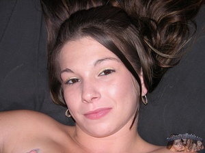 Teen chick sits on a brown couch then strips off her gray and white striped shirtand shows her lusty boobs before she peels down her white skirt and reveals her indulging pussy on a gray and white bed. - XXXonXXX - Pic 13