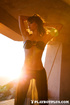 Slim brunette gal shows off her natural body outdoors