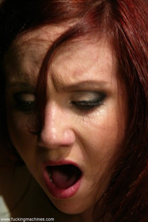 Redhead has some fun with fucking machines in the toilet - Picture 9
