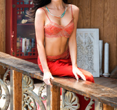 Wonderful brunette chick in red showing her nude body