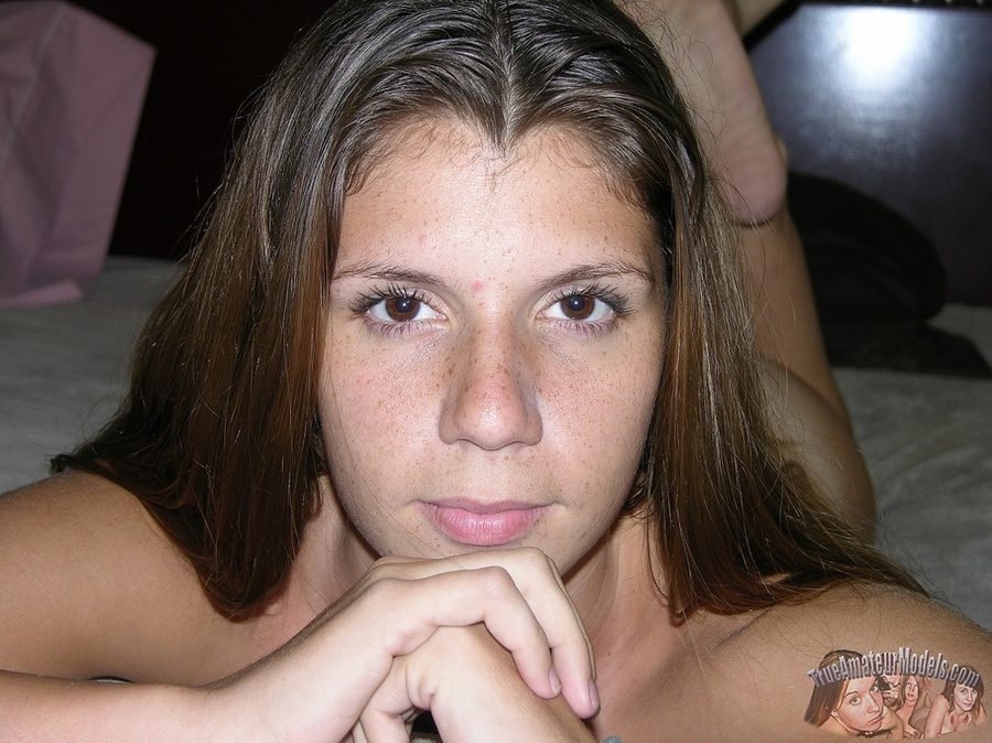 Pretty young hottie pose her sexy curves on a gray couch before she pulls down her blue and white panty and reveals her hot crack then takes off her gray shirt and bares her tiny boobs on a brown stairway and white bed. - XXXonXXX - Pic 1