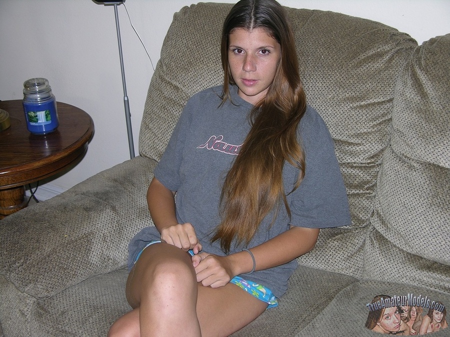 Pretty young hottie pose her sexy curves on a gray couch before she pulls down her blue and white panty and reveals her hot crack then takes off her gray shirt and bares her tiny boobs on a brown stairway and white bed. - XXXonXXX - Pic 2