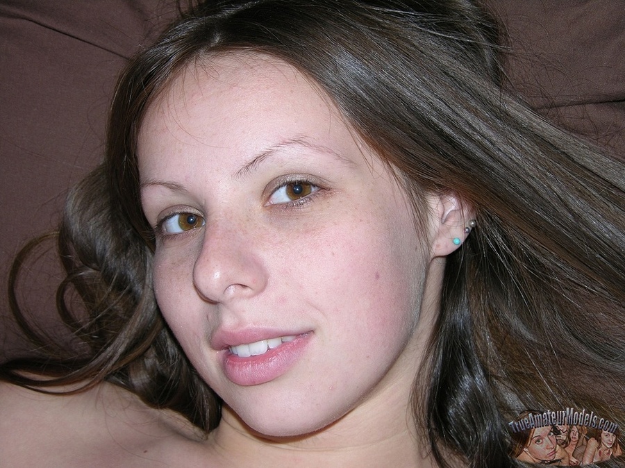 Pretty hottie shows her luscious curves before she spreads wide and displays her twat on a gray couch wearing her sexy pink shirt and gray and pink checkered skirt then gets naked and bares her sweet tits and stunning body in different positions on a brown stairway and white bed. - XXXonXXX - Pic 1