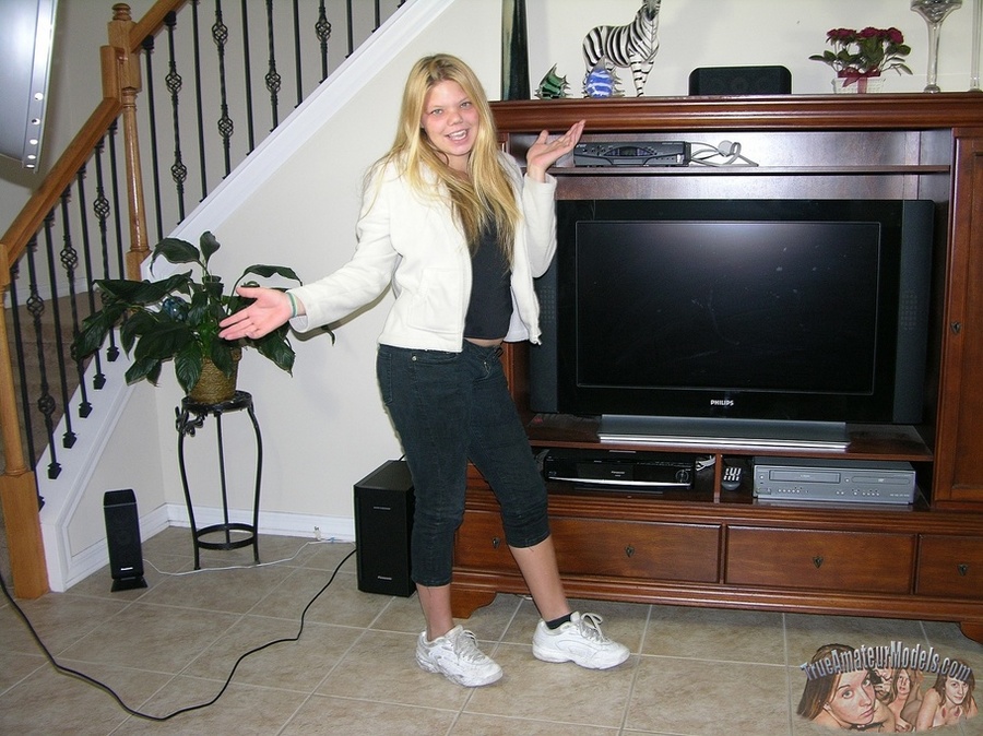 Stunning blonde takes off her white jacket and black shirt then teases with her alluring body and small boobs before she peels off her black pants and white rubber shoes then reveals her sweet crack on a white bed before she kneels down and sucks her man's dick and lets him taste her pussy then bang her in missionary position. - XXXonXXX - Pic 2