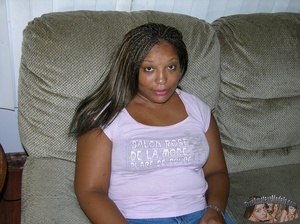 Chubby ebony slowly peels off her pink shirt, black bra and jeans then bares her fat body with luscious boobs and stimulating pussy on gray couches wearing her yellow high heels before she sucks a bald dude's dick then lets him bang her in doggy and missionary style on a brown bed. - XXXonXXX - Pic 1