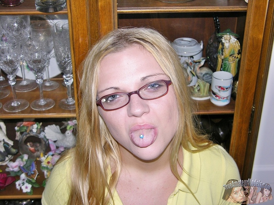 Cute blonde with glasses peels off her yellow shirt and black panty then bares her indulging body with tiny boobs and juicy pussy as she lays naked on a white bed before she gets on her knees and sucks a huge dick then lets it penetrate inside her twat in missionary and doggy positions til it blows on her. - XXXonXXX - Pic 2