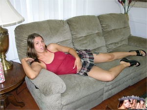 Gorgeous chick lays on a gray couch then allures with her foxy body wearing her sexy pink shirt, black and white checkered skirt, pink thong and black slippers before she strips them off piece by piece and shows her sweet tits while she fingers her wide open pussy on a gray bed and black chair. - XXXonXXX - Pic 2