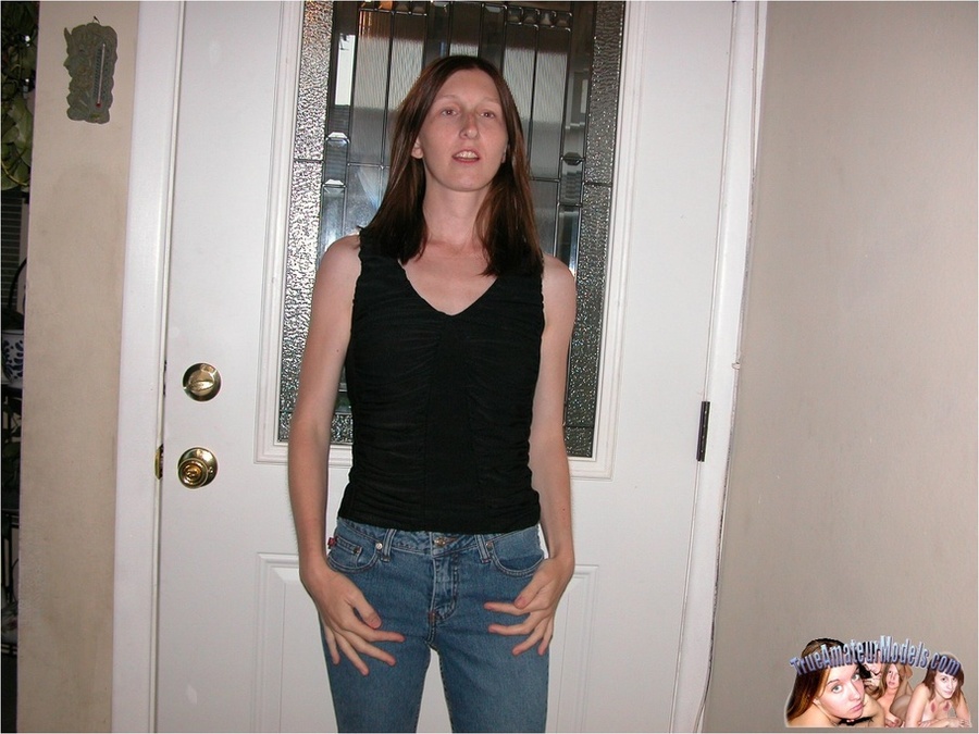Skinny brunette wearing black blouse, jeans and red bra slowly gets naked and expose her juicy tits and as she lays down on a brown couch before she spreads her legs wide and fingers her twat on a multi-colored floral bed. - XXXonXXX - Pic 1