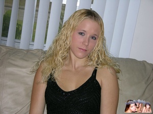 Curly blond hottie sits on a gray couch and takes off her black blouse and jeans then allures with her foxy body in black lingerie before she takes off her bra and bares her small tits then peels down her thong and reveals her pink hole on a maroon bed. - XXXonXXX - Pic 2