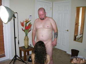 Sweet chick with curly hair and hot body gets down naked and sucks a bald stud's cock before she lets him fuck her in missionary style then cream on her hairy pussy on a brown bed. - Picture 3