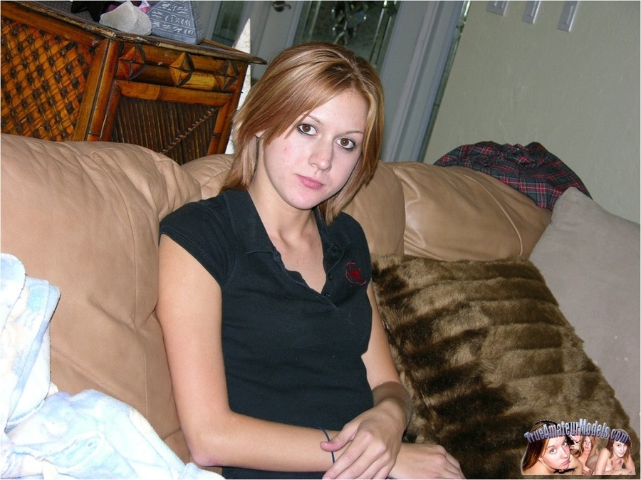 Teen babe peels off her black shirt and pink and black checkered skirt then pose her skinny body in black underwear before she gets naked and expose her small boobs and indulging twat on a multi-colored bed. - XXXonXXX - Pic 2