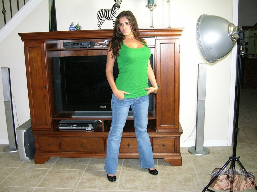 Smoking hot chick with curly brown hair pose on a gray couch before she peels off her green shirt and jeans then seduces with her banging body in black underwear before she takes them off and reveals her luscious boobs and stimulating pussy on a brown stairway and gray bed. - XXXonXXX - Pic 4